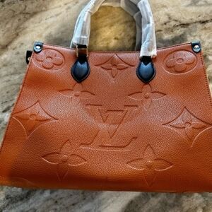 Embossed Monogram Cognac Tote with Black Handles